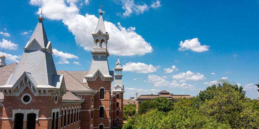 Skyline of Baylor's Quadrangle with a bright blue sky and white clouds