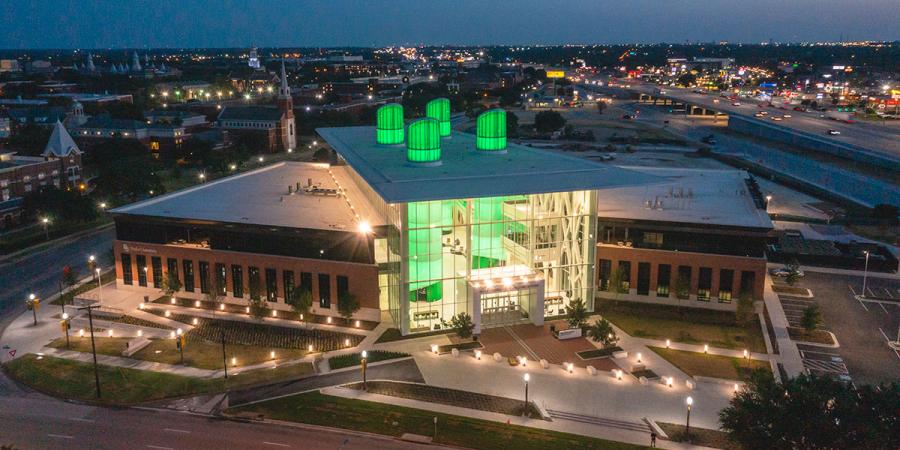Hurd Welcome Center aerial night shot, with columns lit green