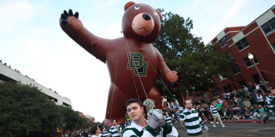 the Bear balloon carried through campus during the Baylor Homecoming parade