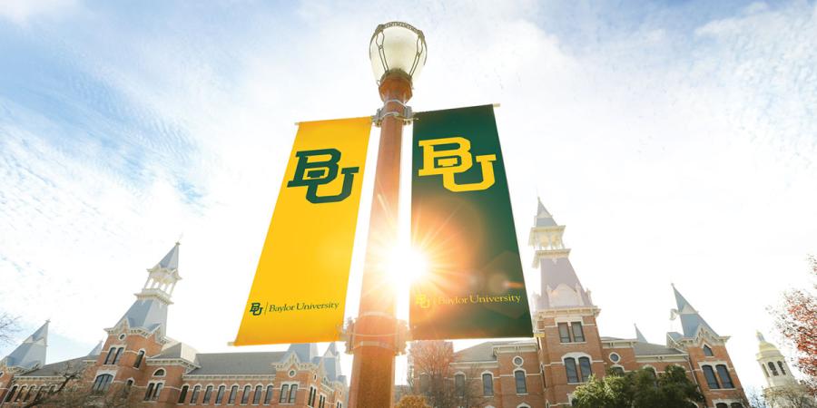 A lamppost with Baylor banners in the Quadrangle