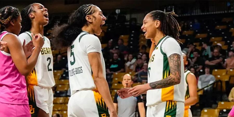 Darianna Littlepage-Buggs and Taliah Scott celebrate on the court