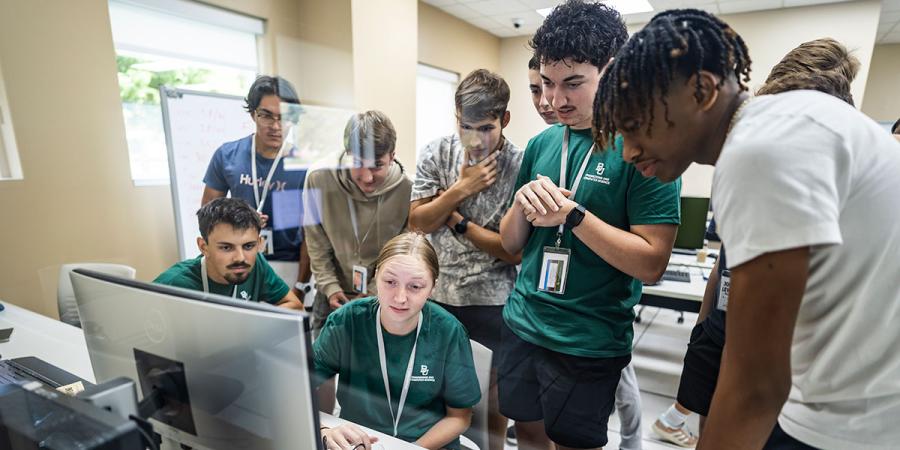 Students huddle at Baylor Engineering and Computer Science's Innovate camp
