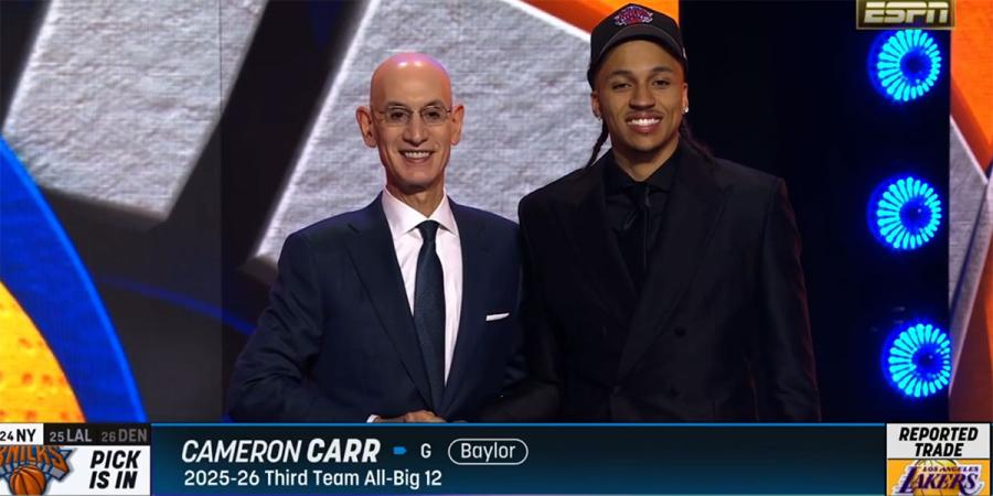 Cameron Carr poses with NBA Commissioner Adam Silver after being selected in Tuesday's NBA draft